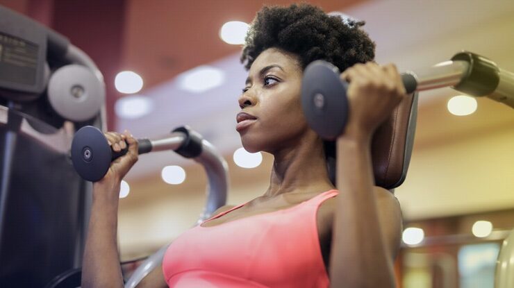 Black woman exercising to meet fitness goals