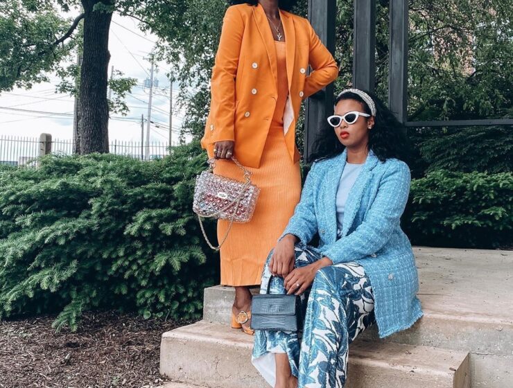 personal style - two stylish black women dress in blue and orange suits