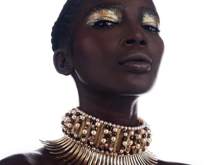 black woman wearing a spiky gold choker
