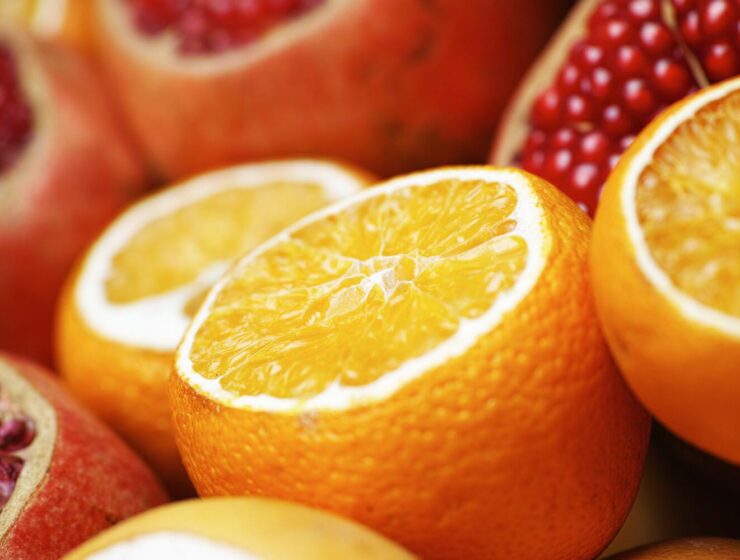 multivitamins - image of sliced oranges and pomegranates
