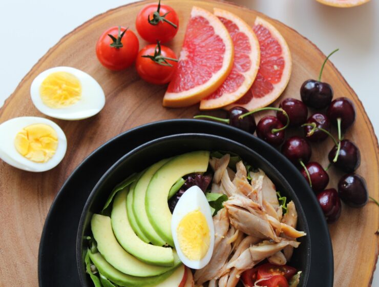 hormonal imbalance - plate of avocado, eggs, chicken and fruits