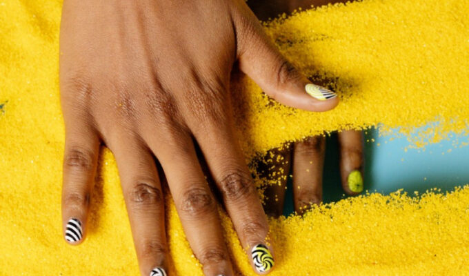 nail care - a black woman hand spread out