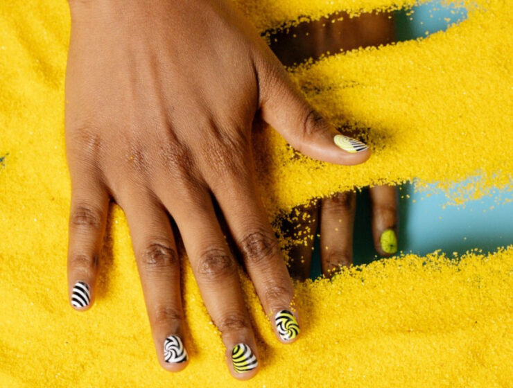 nail care - a black woman hand spread out