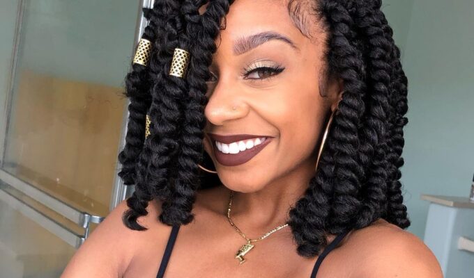 Black woman showcasing braids hairstyles
