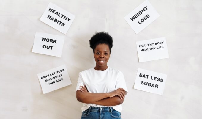 Black woman surrounded by healthy habits text
