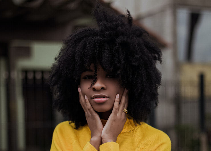 black woman with natural hair treatment