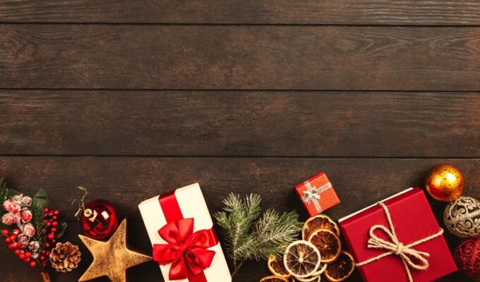 Gift boxes and Christmas ornaments displayed on a table