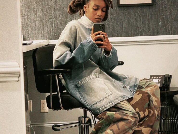 Little Simz takes a photo with her phone