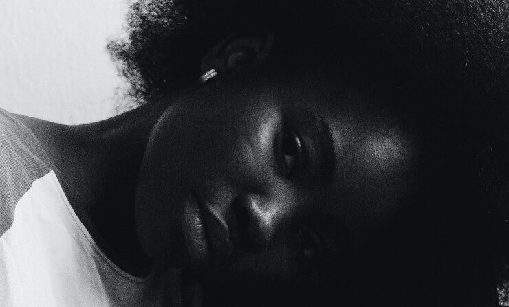 Black woman with her head down in depression