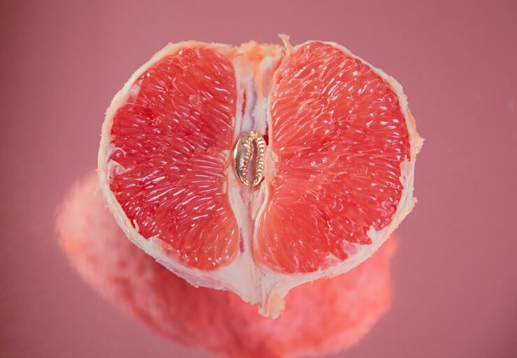 An open orange representing vagina to demonstrate pap smear testing