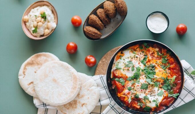 African traditional meals, chakchouka, and pita bread on display