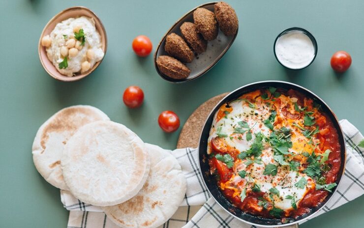 African traditional meals, chakchouka, and pita bread on display