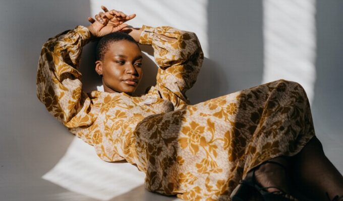 Black woman lying down practicing emotional intelligence