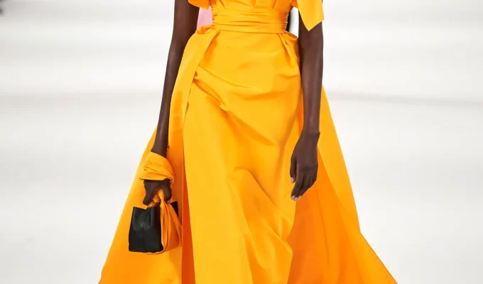 Caren Jepkemei wearing an orange gown by Carolina Herrera