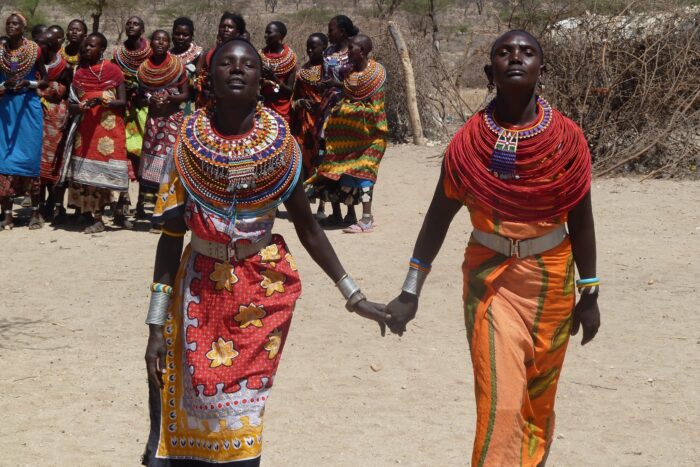 African women holding hands