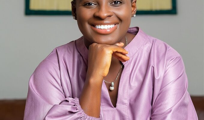 Smiling Black woman wearing lilac dress with hand on chin practicing healthy balance