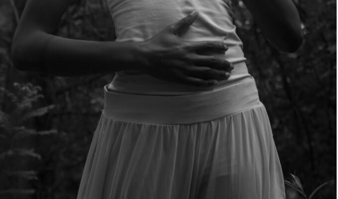 woman touching her abdomen checking reproductive health