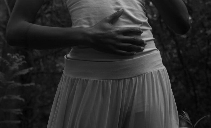 woman touching her abdomen checking reproductive health