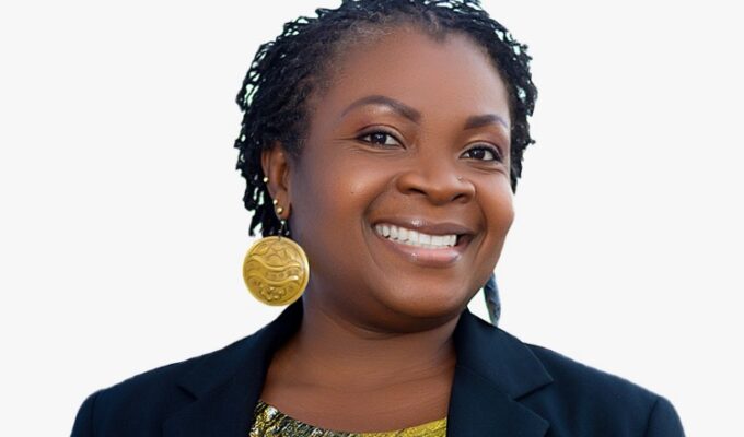 Ghanaian Communications Specialist Esi Arhin smiles