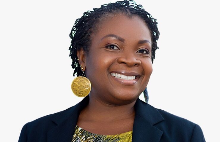 Ghanaian Communications Specialist Esi Arhin smiles