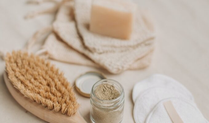 Eco-friendly products including brush and soap displayed on a table