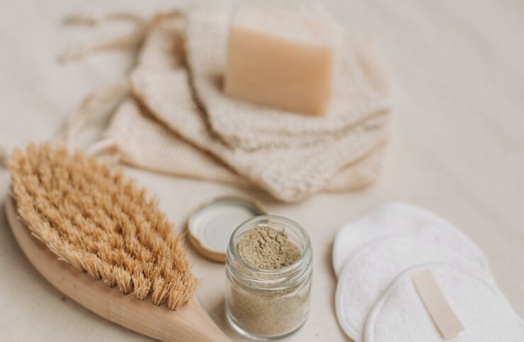 Eco-friendly products including brush and soap displayed on a table
