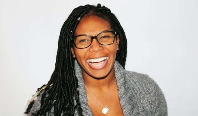 Black woman laughing demonstrating good financial health