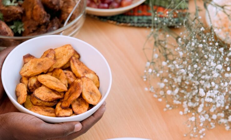 Fried plantains held in a bowl