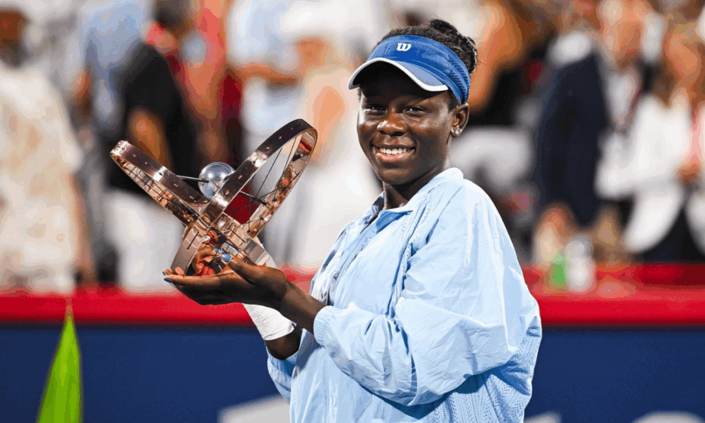 Victoria Mboko holding her Canadian Open Trophy