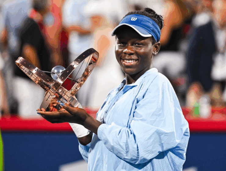Victoria Mboko holding her Canadian Open Trophy
