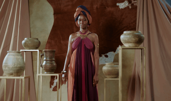 Glowing African woman radiating health and vitality, representing Our Kind of Well.