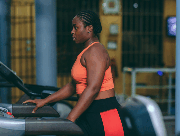 black woman at the gym on a treadmill
