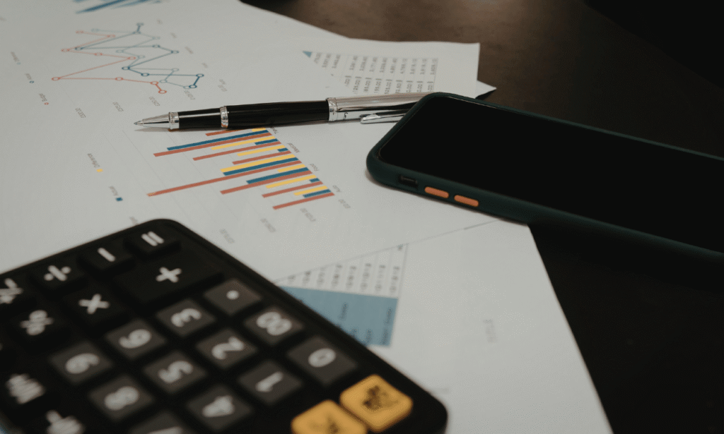 Person reviewing their finances while applying financial rules to know by 30