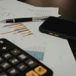 Person reviewing their finances while applying financial rules to know by 30