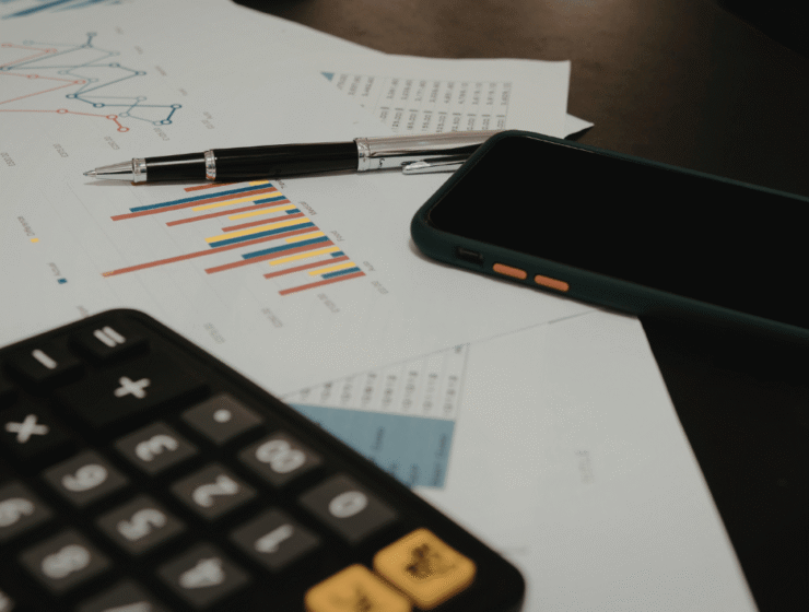Person reviewing their finances while applying financial rules to know by 30