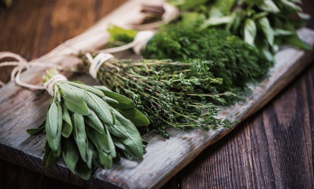 Fresh herbs for stress relief arranged on a wooden board