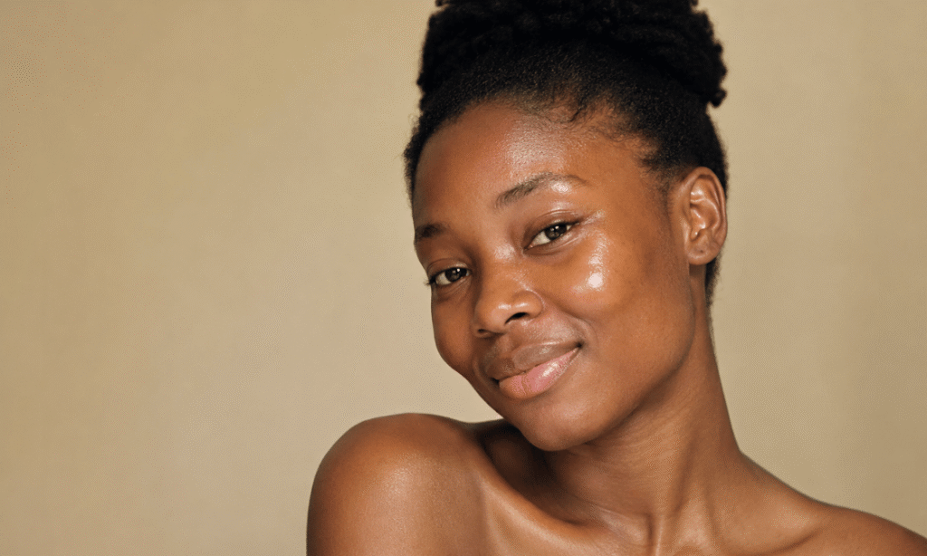 African woman with glowing natural skin, illustrating healthy skin and premature skin aging prevention