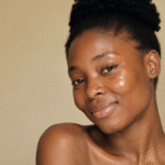 African woman with glowing natural skin, illustrating healthy skin and premature skin aging prevention