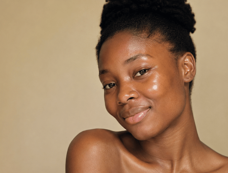 African woman with glowing natural skin, illustrating healthy skin and premature skin aging prevention